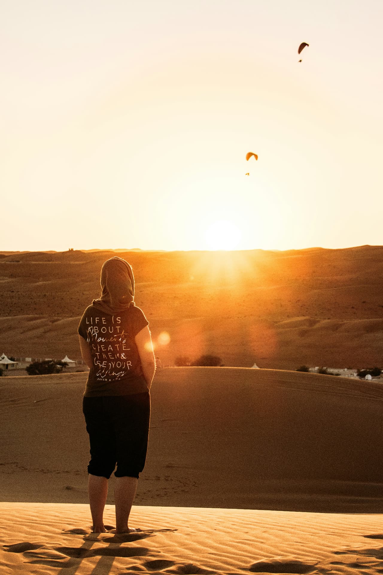 Traveller watching sunset over the Erg Chebbi dunes